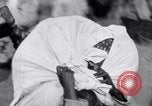 Image of Hindu pilgrims giving gifts to priests during their pilgrimage India, 1939, second 20 stock footage video 65675028618