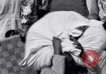 Image of Hindu pilgrims giving gifts to priests during their pilgrimage India, 1939, second 22 stock footage video 65675028618