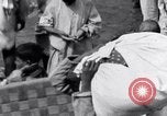 Image of Hindu pilgrims giving gifts to priests during their pilgrimage India, 1939, second 23 stock footage video 65675028618