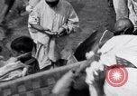 Image of Hindu pilgrims giving gifts to priests during their pilgrimage India, 1939, second 24 stock footage video 65675028618