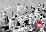 Image of Hindu pilgrims giving gifts to priests during their pilgrimage India, 1939, second 26 stock footage video 65675028618