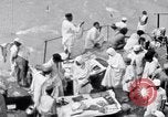 Image of Hindu pilgrims giving gifts to priests during their pilgrimage India, 1939, second 27 stock footage video 65675028618