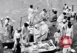 Image of Hindu pilgrims giving gifts to priests during their pilgrimage India, 1939, second 29 stock footage video 65675028618