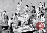Image of Hindu pilgrims giving gifts to priests during their pilgrimage India, 1939, second 30 stock footage video 65675028618