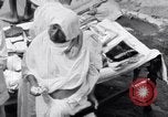 Image of Hindu pilgrims giving gifts to priests during their pilgrimage India, 1939, second 32 stock footage video 65675028618