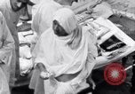 Image of Hindu pilgrims giving gifts to priests during their pilgrimage India, 1939, second 33 stock footage video 65675028618