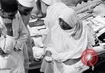 Image of Hindu pilgrims giving gifts to priests during their pilgrimage India, 1939, second 34 stock footage video 65675028618