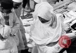 Image of Hindu pilgrims giving gifts to priests during their pilgrimage India, 1939, second 35 stock footage video 65675028618