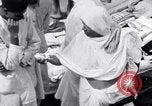 Image of Hindu pilgrims giving gifts to priests during their pilgrimage India, 1939, second 36 stock footage video 65675028618