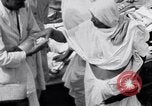 Image of Hindu pilgrims giving gifts to priests during their pilgrimage India, 1939, second 37 stock footage video 65675028618