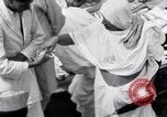 Image of Hindu pilgrims giving gifts to priests during their pilgrimage India, 1939, second 38 stock footage video 65675028618