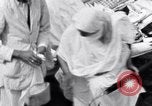 Image of Hindu pilgrims giving gifts to priests during their pilgrimage India, 1939, second 40 stock footage video 65675028618