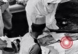 Image of Hindu pilgrims giving gifts to priests during their pilgrimage India, 1939, second 42 stock footage video 65675028618