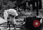 Image of Hindu pilgrims giving gifts to priests during their pilgrimage India, 1939, second 43 stock footage video 65675028618