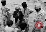 Image of Hindu pilgrims giving gifts to priests during their pilgrimage India, 1939, second 59 stock footage video 65675028618