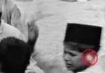 Image of Hindu pilgrims giving gifts to priests during their pilgrimage India, 1939, second 62 stock footage video 65675028618