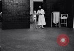 Immagine di Crippled bambino con un infermiere United States USA, 1920, secondo 6 filmato di repertorio 65675028690