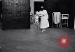 Immagine di Crippled bambino con un infermiere United States USA, 1920, secondo 9 filmato di repertorio 65675028690