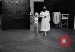 Immagine di Crippled bambino con un infermiere United States USA, 1920, secondo 11 filmato di repertorio 65675028690