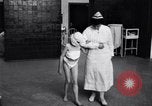 Immagine di Crippled bambino con un infermiere United States USA, 1920, secondo 17 filmato di repertorio 65675028690