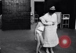 Immagine di Crippled bambino con un infermiere United States USA, 1920, secondo 18 filmato di repertorio 65675028690