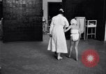 Immagine di Crippled bambino con un infermiere United States USA, 1920, secondo 23 filmato di repertorio 65675028690