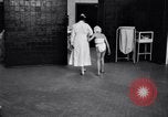 Immagine di Crippled bambino con un infermiere United States USA, 1920, secondo 27 filmato di repertorio 65675028690