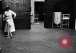 Immagine di Crippled bambino con un infermiere United States USA, 1920, secondo 47 filmato di repertorio 65675028690