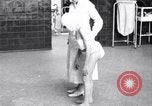 Immagine di Crippled bambino con un infermiere United States USA, 1920, secondo 58 filmato di repertorio 65675028690