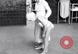 Immagine di Crippled bambino con un infermiere United States USA, 1920, secondo 59 filmato di repertorio 65675028690