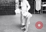 Immagine di Crippled bambino con un infermiere United States USA, 1920, secondo 60 filmato di repertorio 65675028690