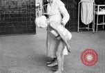 Immagine di Crippled bambino con un infermiere United States USA, 1920, secondo 62 filmato di repertorio 65675028690