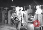 Image of industrial workers at ingot-furnace United States USA, 1920, second 3 stock footage video 65675028691