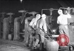 Image of industrial workers at ingot-furnace United States USA, 1920, second 7 stock footage video 65675028691