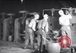 Image of industrial workers at ingot-furnace United States USA, 1920, second 8 stock footage video 65675028691