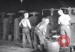 Image of industrial workers at ingot-furnace United States USA, 1920, second 9 stock footage video 65675028691