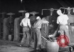 Image of industrial workers at ingot-furnace United States USA, 1920, second 11 stock footage video 65675028691