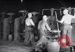 Image of industrial workers at ingot-furnace United States USA, 1920, second 13 stock footage video 65675028691