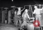 Image of industrial workers at ingot-furnace United States USA, 1920, second 14 stock footage video 65675028691