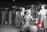 Image of industrial workers at ingot-furnace United States USA, 1920, second 15 stock footage video 65675028691