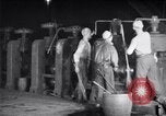 Image of industrial workers at ingot-furnace United States USA, 1920, second 16 stock footage video 65675028691