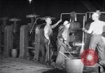 Image of industrial workers at ingot-furnace United States USA, 1920, second 17 stock footage video 65675028691