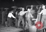Image of industrial workers at ingot-furnace United States USA, 1920, second 20 stock footage video 65675028691