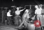 Image of industrial workers at ingot-furnace United States USA, 1920, second 21 stock footage video 65675028691