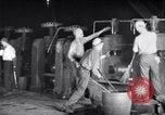 Image of industrial workers at ingot-furnace United States USA, 1920, second 22 stock footage video 65675028691