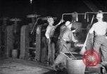 Image of industrial workers at ingot-furnace United States USA, 1920, second 23 stock footage video 65675028691