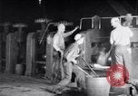 Image of industrial workers at ingot-furnace United States USA, 1920, second 24 stock footage video 65675028691