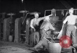 Image of industrial workers at ingot-furnace United States USA, 1920, second 25 stock footage video 65675028691