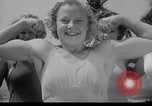 Image of Relna Brewster wrestles male opponent Venice Beach Los Angeles California USA, 1938, second 10 stock footage video 65675028765
