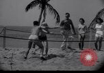 Image of Relna Brewster wrestles male opponent Venice Beach Los Angeles California USA, 1938, second 13 stock footage video 65675028765